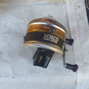 Zebco Fishing Reel with Black and Silver Accents